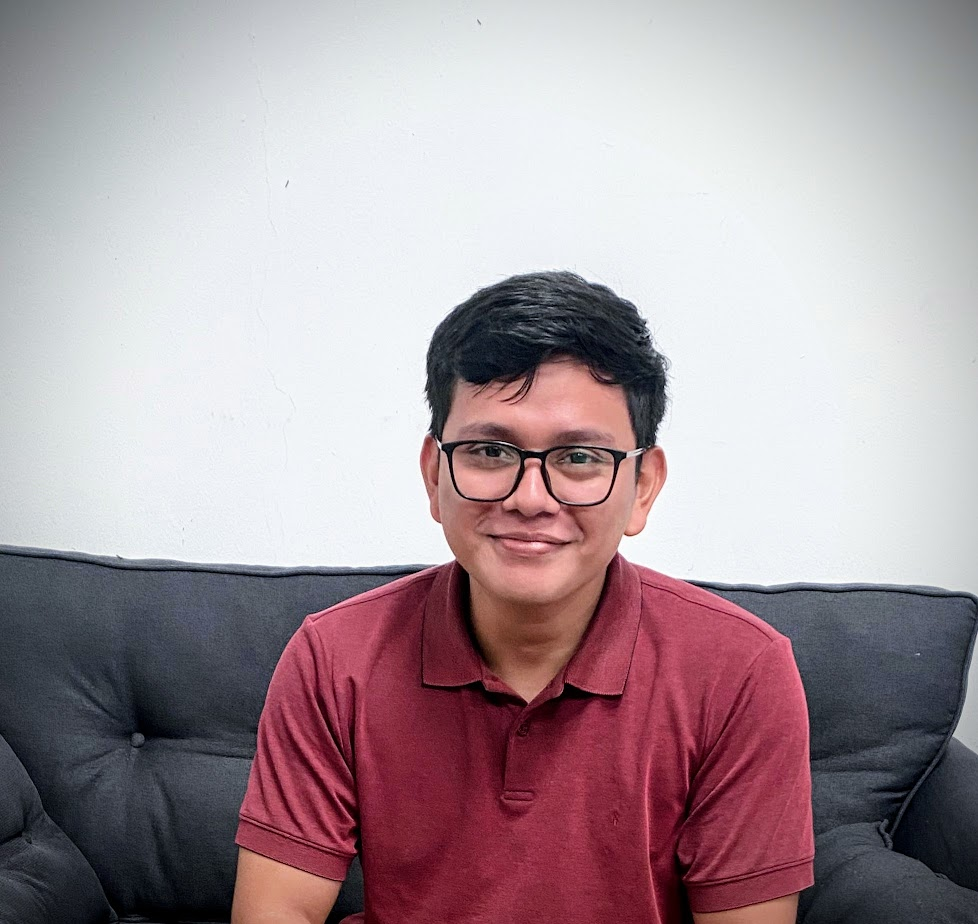 Woman gazing through two glasses of water